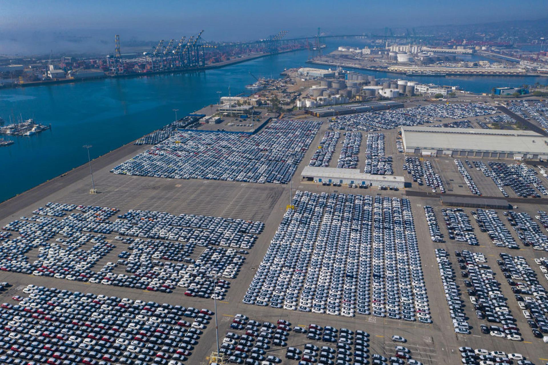 New vehicles awaiting shipment at a seaport terminal, aerial view